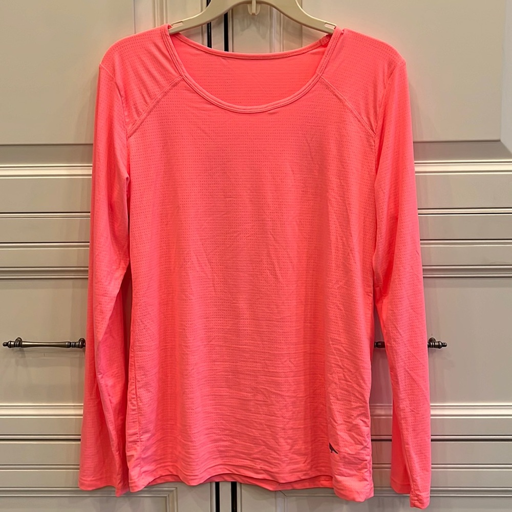 Orange (coral) long sleeve athletic top with soft breathable material, size M